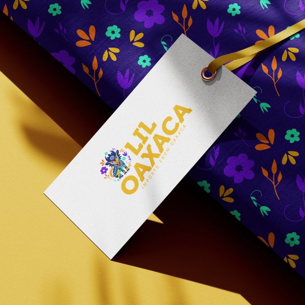 Lil Oaxaca logo on gift tag mockup, featuring brand pattern